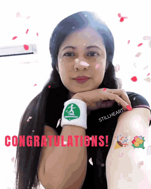 a woman wearing a wristband that says stillheart