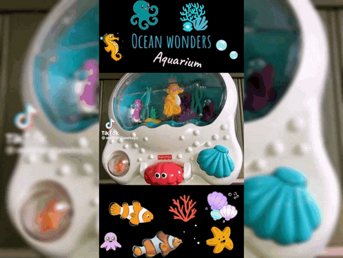 a fisher price ocean wonders aquarium toy with fish and seashells