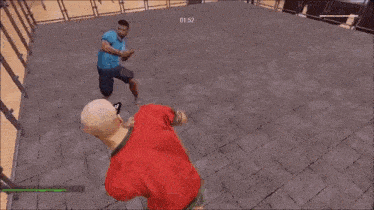 a man in a red shirt is jumping over a metal fence .