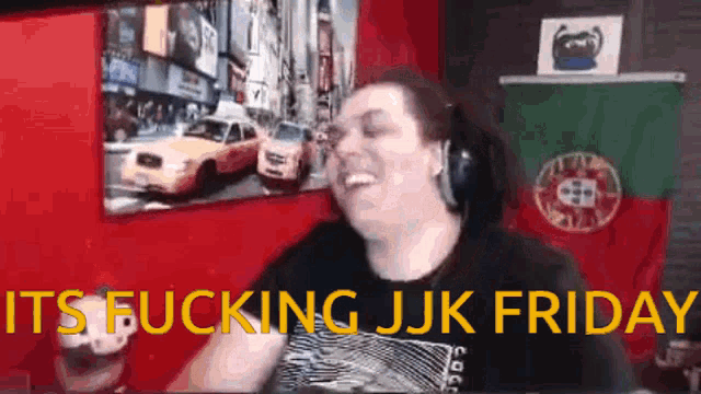 a man is laughing in front of a picture that says it 's fucking jjk friday ..