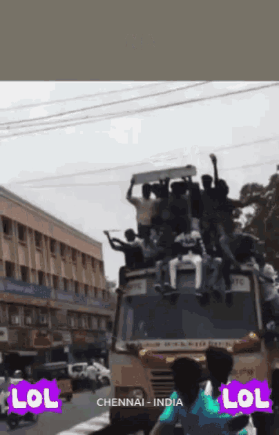 a group of people are sitting on top of a bus in chennai