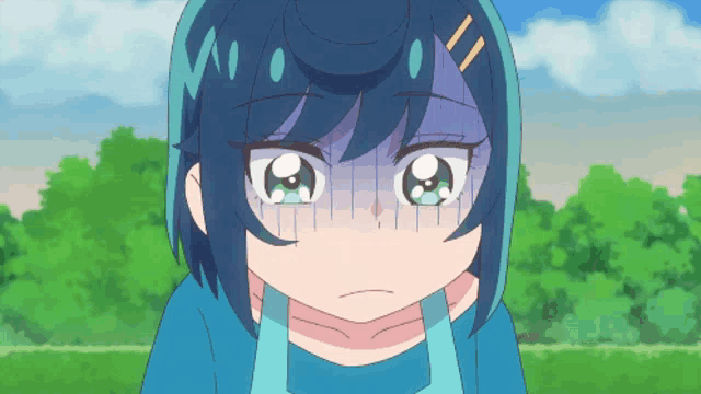 a close up of a girl 's face with a shocked look on her face