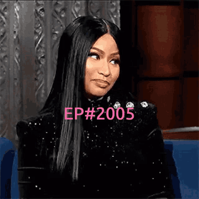 a woman with long black hair is sitting in a chair with the words `` ep # 2005 '' written on her face .