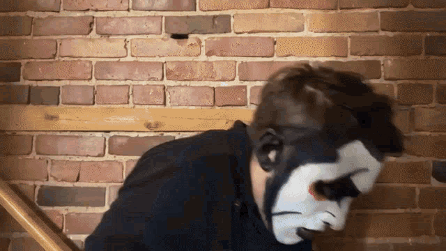 a man with a clown face painted on his face