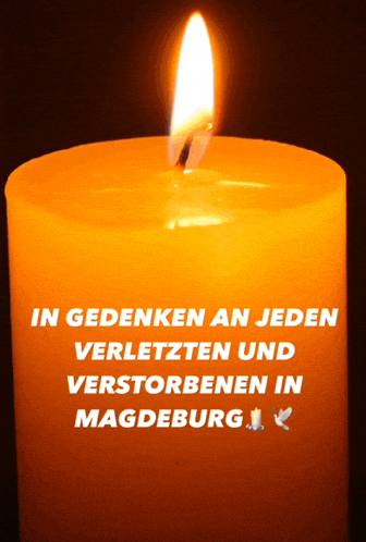 a candle with the words in gedenken an jeden verletzten und verstorbenen in magdeburg