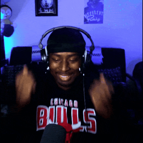 a man wearing headphones and a shirt that says bulls