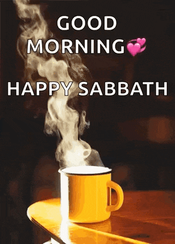 a cup of coffee is sitting on a wooden table with smoke coming out of it and the words `` good morning happy sabbath '' .