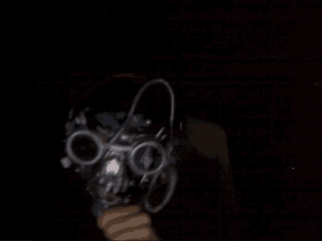 a blurred image of a person 's face with a black background