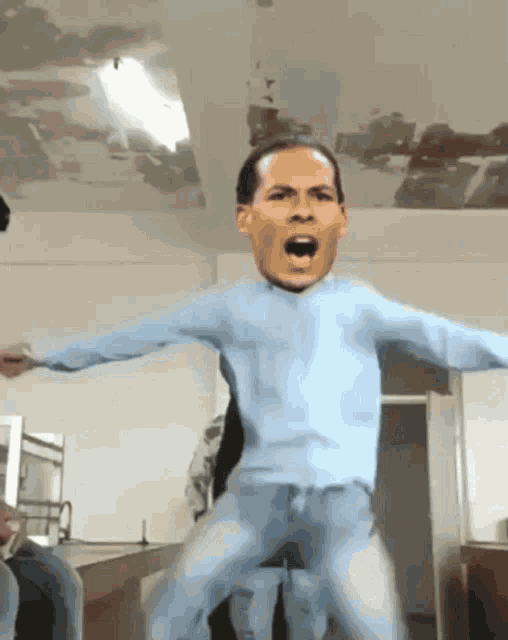 a man in a blue shirt is jumping in the air with his mouth wide open