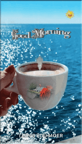 a person holding a cup of coffee with the words good morning i love you moer on the bottom