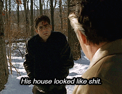 two men are standing in the snow and one of them is saying his house looked like shit