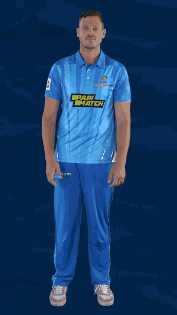 a man wearing a blue shirt with pari match on it