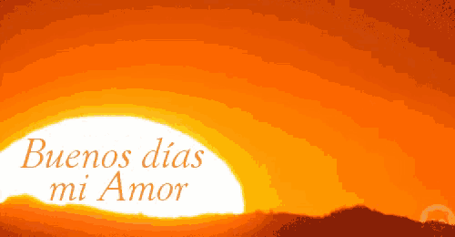 a sunset with the words buenos dias mi amor