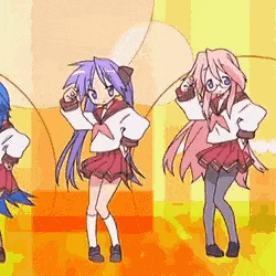 a group of anime girls are dancing together on a stage .