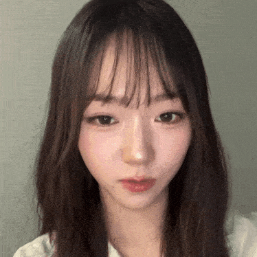 a close up of a woman 's face with long hair