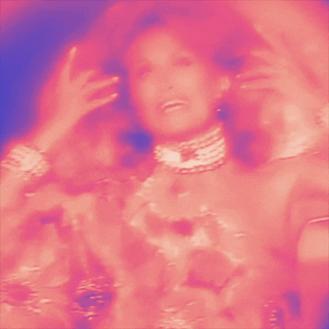 a blurry picture of a woman wearing a choker necklace and bracelets .