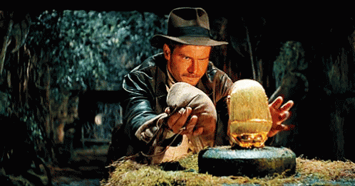 Putting Your Boyfriend'S Phone Back After Going Thru It GIF - Indiana Jones Gold Treasure GIFs