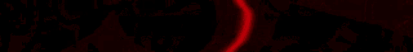 a close up of a red curtain with a chain hanging from it .