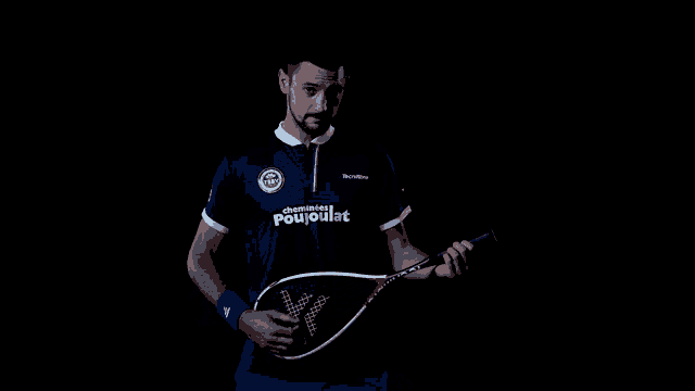 a man is holding a tennis racquet and wearing a shirt that says pouvoirat