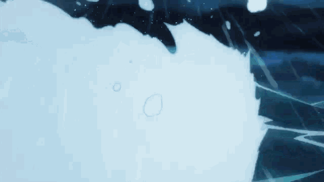 a close up of a wave in the ocean with a dark background .