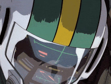 a close up of a pilot 's helmet with a green and yellow strip