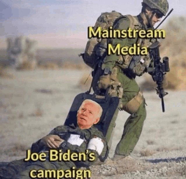 a soldier pushes a man in a wheelchair with joe biden 's face on it