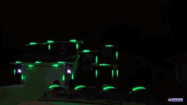 a house decorated for halloween with a subscribe button on the bottom