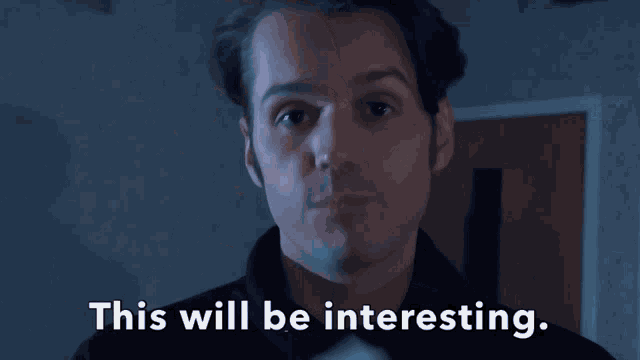 a man says " this will be very interesting " in a dark room
