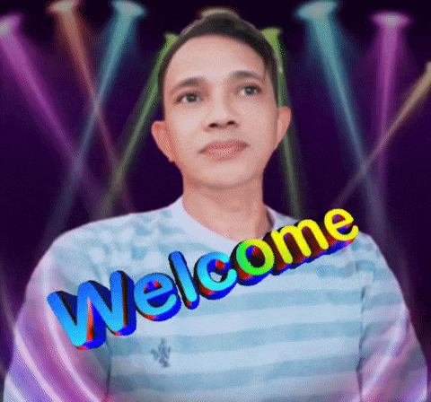 a man wearing a blue striped shirt with the words welcome written on it