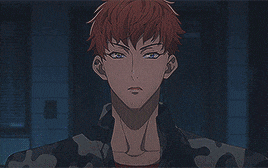 a close up of a man 's face with red hair and blue eyes