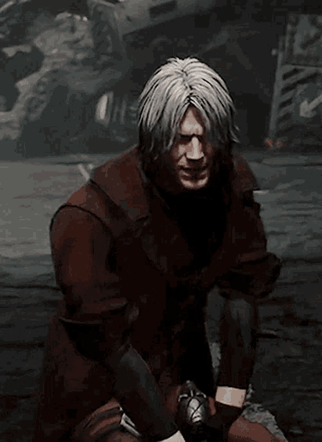 a man with white hair and a red jacket is looking at the camera