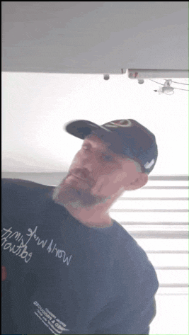a man with a beard wearing a hat and a shirt that says " i 'm with you " on it