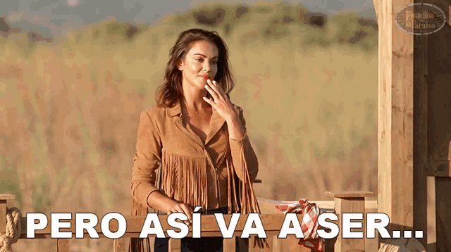 a woman in a fringed jacket is smoking a cigarette and the words pero asi va a ser