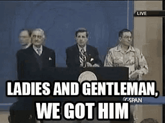 a group of men standing at a podium with the words `` ladies and gentleman we got him '' written on the screen .