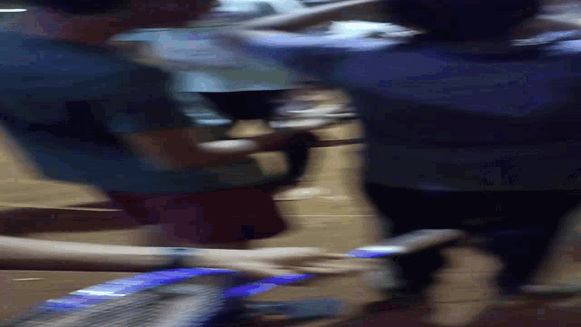 a blurry picture of a person holding a light up object