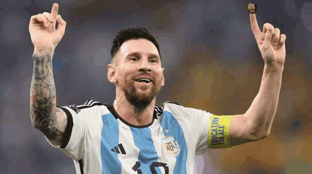 a soccer player wearing a blue and white jersey with the number 10 on it
