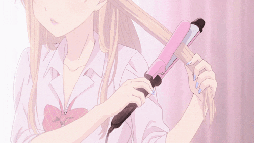 a girl is curling her hair with a pink curler
