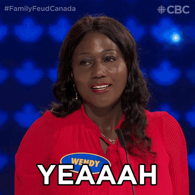 a woman in a red shirt with wendy yeaaah on her shirt