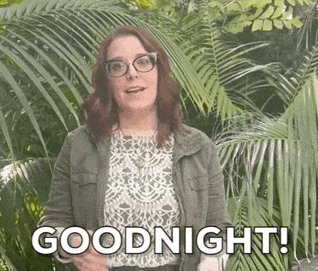 a woman wearing glasses and a jacket says goodnight