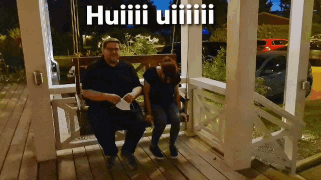 a man and a woman sit on a porch swing with the caption huiiii uiiii
