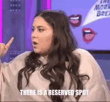 a woman says there is a reserved spot in front of her