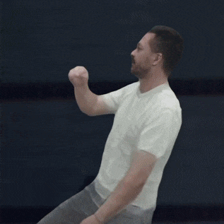 a man with a beard wearing a white t-shirt