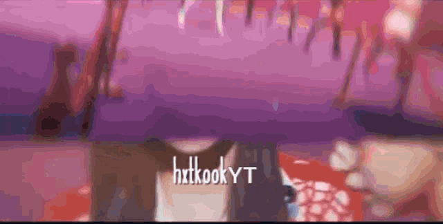 a purple background with the word hxtkookyt in white letters