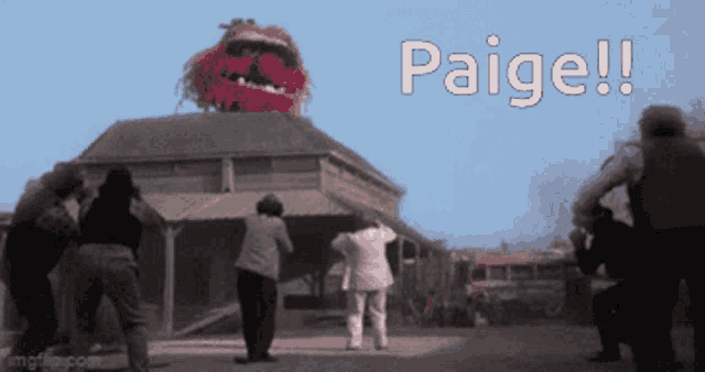 a group of people standing in front of a building with the words paige written on the bottom