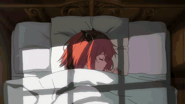 a girl with a cat ear is sleeping in a bed