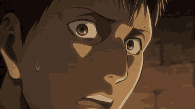 a close up of a person 's face with a tear coming out of his eye