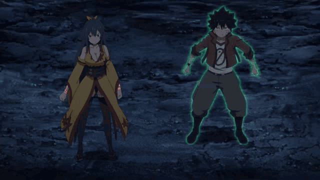 a man and a woman are standing next to each other in a dark room