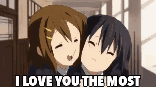 two anime girls are hugging each other in a hallway and the words `` i love you the most '' are written above them .