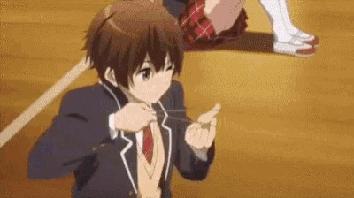 a boy in a school uniform is tying his tie while a girl sits on the floor .