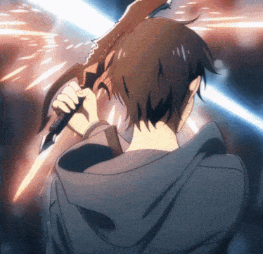 a man in a hoodie holds a sword in his hand